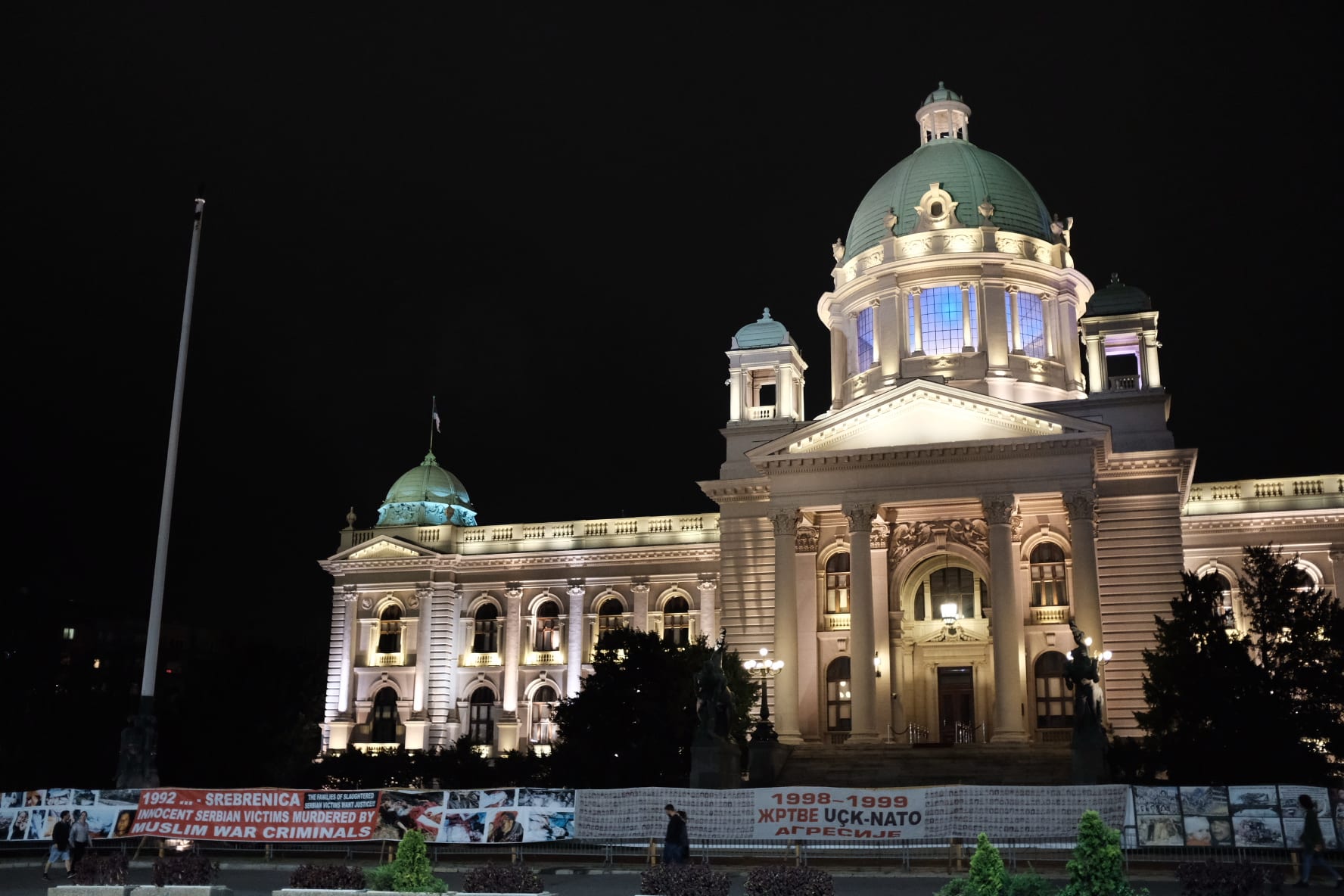 See protest posters hung outside the national assembly of “Innocent Serbian Victims Murdered By Muslim War Criminals”