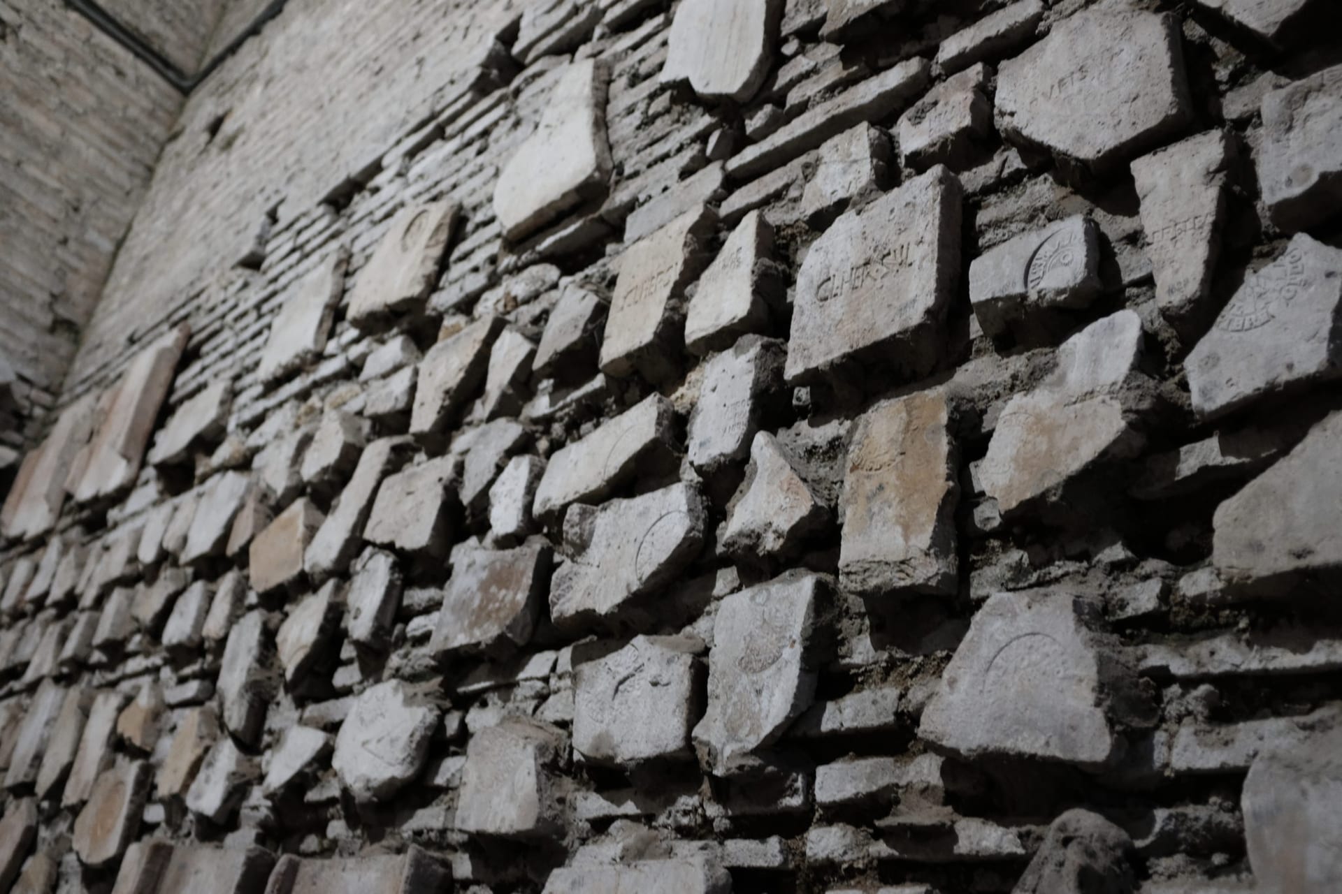 As artifacts were found, they would plug them back into other areas of the building. Here artifacts from early catacombs were taken and adorn newer sections within the basilica.
