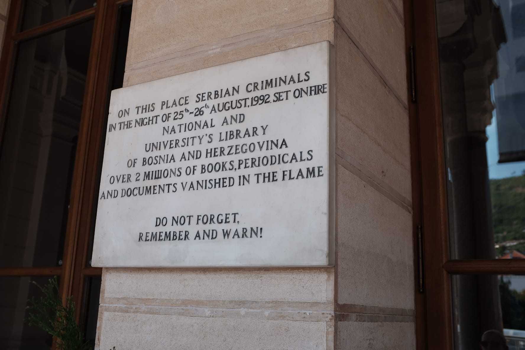 Sarajevo City Hall – Plaque as seen before entering the building – Remembering may be important, but words like these do not heal